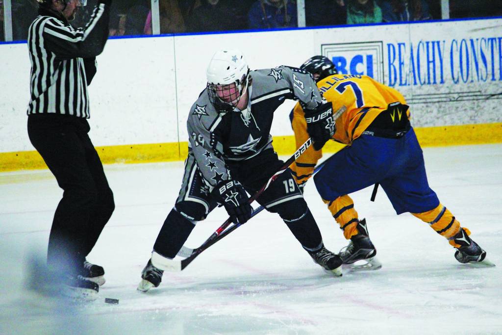 Soldotnas Ethan Yeager and Homers Tyler Gilliland fight over the puck during a Friday, Nov. 15, 2019 hockey game at Kevin Bell Arena in Homer, Alaska during the End of the Road Shootout Tournament. (Photo by Megan Pacer/Homer News)