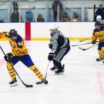Homers Phinny Weston maneuvers the puck away from Soldotnas Dylan Dahlgren during a Friday, Nov. 15, 2019 hockey game at Kevin Bell Arena in Homer, Alaska during the End of the Road Shootout tournament. (Photo by Megan Pacer/Homer News)