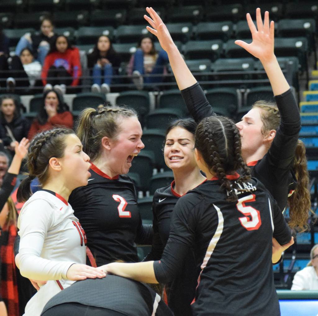 Kenai Central players celebrate a point Saturday, Nov. 16, 2019, against Homer at the Class 3A state volleyball tournament at the Alaska Airlines Center in Anchorage, Alaska. (Photo by Joey Klecka/Peninsula Clarion)