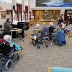 Michael Penn / Juneau Empire                                 Volunteer Victor Carlisle sings and plays the piano for Juneau Pioneer Home residents on Friday.
