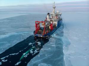 In this Nov. 14, 2019, photo provided by John Guillote and taken from an aerial drone shows the U.S. research vessel Sikuliaq as it makes its way through sea ice in the Beaufort Sea off Alaskas north coast. University of Washington scientists onboard the research vessel are studying the changes and how less sea ice will affect coastlines, which already are vulnerable to erosion because increased waves delivered by storms. More erosion would increase the chance of winter flooding in villages and danger to hunters in small boats. (John Guillote via AP)