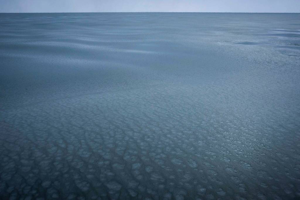 This Nov. 12, 2019, photo provided by John Guillote shows a view from the research vessel Sikuliaq near Jones Island in the Beaufort Sea. University of Washington scientists onboard the research vessel are studying the changes and how less sea ice will affect coastlines, which already are vulnerable to erosion because increased waves delivered by storms. More erosion would increase the chance of winter flooding in villages and danger to hunters in small boats. (John Guillote via AP)