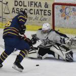 Homers Ethan Pitzman challenges Soldotna goalie Corbin Wirz at the net Friday, Nov. 22, 2019, at the Soldotna Regional Sports Complex in Soldotna, Alaska. (Photo by Joey Klecka/Peninsula Clarion)