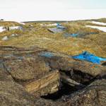 This May 3, 2009, photo taken in Point Hope, Alaska, provided by the Alaska Native Tribal Health Consortium, shows the entrance to an ice cellar, a type of underground food cache dug into the permafrost to provide natural refrigeration used for generations in far-north communities. Naturally cooled underground ice cellars, used in Alaska Native communities for generations, are becoming increasingly unreliable as a warming climate and other factors touch multiple facets of life in the far north. (Mike Brubaker/Alaska Native Tribal Health Consortium via AP)