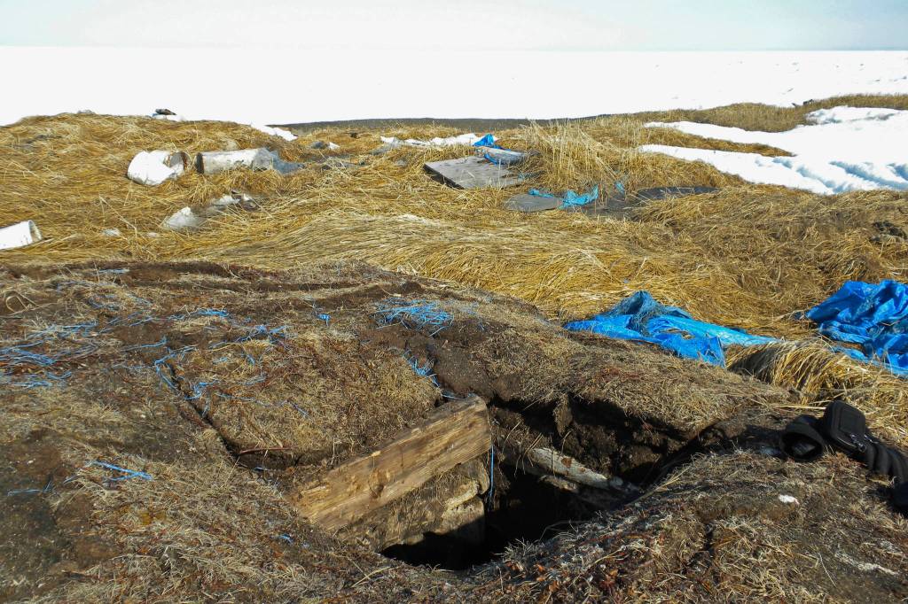This May 3, 2009, photo taken in Point Hope, Alaska, provided by the Alaska Native Tribal Health Consortium, shows the entrance to an ice cellar, a type of underground food cache dug into the permafrost to provide natural refrigeration used for generations in far-north communities. Naturally cooled underground ice cellars, used in Alaska Native communities for generations, are becoming increasingly unreliable as a warming climate and other factors touch multiple facets of life in the far north. (Mike Brubaker/Alaska Native Tribal Health Consortium via AP)