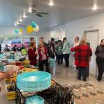 Residents of the Kenai Intentional Neighborhood celebrate the completion of their clubhouse with friends, family and Hope Community Resources board members in Soldotna, Alaska on Nov. 22, 2019. (Photo courtesy Kathy Fitzgerald)