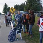 Tela Bacher holds a sign Saturday, Nov. 23, 2019, at a vigil for Anesha Duffy Murnane, a Homer woman missing since Oct. 17, at WKFL Park in Homer, Alaska. Sinn helped organize the vigil. (Photo by Michael Armstrong/Homer News)