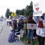 Shelby Sinn holds a sign Saturday, Nov. 23, 2019, at a vigil for Anesha Duffy Murnane, a Homer woman missing since Oct. 17, at WKFL Park in Homer, Alaska. Sinn helped organize the vigil. (Photo by Michael Armstrong/Homer News)