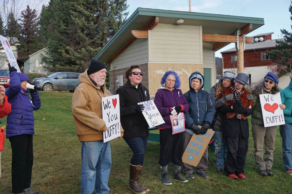 Homer United Methodist Church Pastor Lisa Talbott, third from left, leads a prayer Saturday, Nov. 23, 2019, at a vigil for Anesha Duffy Murnane, a Homer woman missing since Oct. 17, at WKFL Park in Homer, Alaska. (Photo by Michael Armstrong/Homer News)