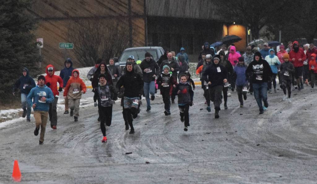 The field of runners take off Thursday, Nov. 28, 2019, at the Turkey Trot in Soldotna, Alaska. (Photo by Joey Klecka/Peninsula Clarion)