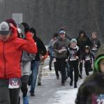 Runners stream down the Unity Trail early Thursday, Nov. 28, 2019, at the Turkey Trot in Soldotna, Alaska. (Photo by Joey Klecka/Peninsula Clarion)