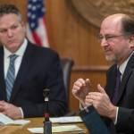 In this file photo, Gov. Mike Dunleavy, left, listens as Attorney General Kevin Clarkson describes three constitutional amendments that would be a foundation of his administrations fiscal plan during a press conference at the Capitol on Wednesday, Jan. 30, 2019. (Michael Penn | Juneau Empire File)