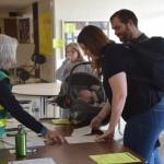 CERT volunteers sign people in to the Disaster Help Center at Kenai Middle School in Kenai, Alaska, during OEMs Alaska Shield 2019 program on April 13, 2019. (Photo by Brian Mazurek/Peninsula Clarion)