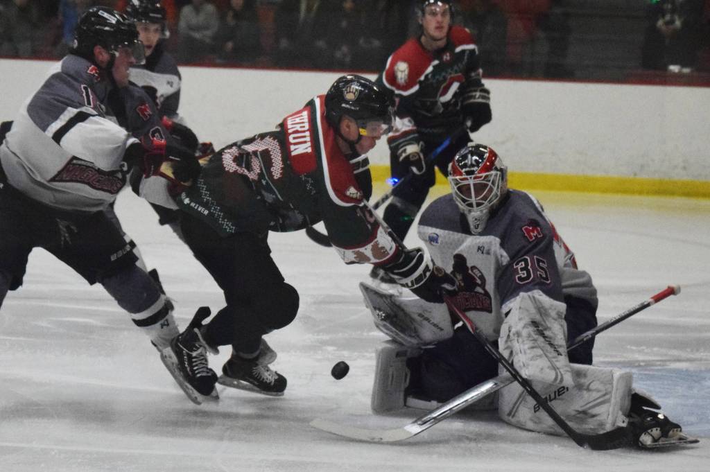 Kenai Rivers Theo Thrun takes a shot on Minnesota goalie Samuel Vyletelka, Friday, Nov. 29, 2019, at the Soldotna Regional Sports Complex in Soldotna, Alaska. (Photo by Joey Klecka/Peninsula Clarion)