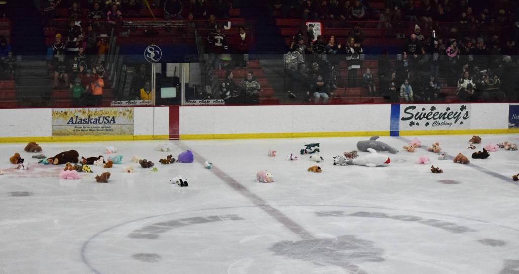 Toy animals litter the ice Friday, Nov. 29, 2019, after fans participated in a charity toss following the first goal of the game between the Kenai River Brown Bears and the Minnesota Magicians at the Soldotna Regional Sports Complex in Soldotna, Alaska. (Photo by Joey Klecka/Peninsula Clarion)