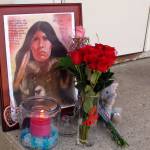 A makeshift memorial to Savanna Greywind featuring a painting, flowers, candle and a stuffed animal is seen on Monday, Aug. 28, 2017, in Fargo, N.D., outside the apartment where Greywind lived with her parents. Republican U.S. Sen. Lisa Murkowski from Alaska is taking up the cause for a bill aimed at helping law enforcement with cases of murdered and missing indigenous women. Former North Dakota Democratic Sen. Heidi Heitkamp introduced and helped pass Savannas Act in the Senate before she lost election, but it was blocked in the House by a retiring Republican. (AP Photo/Dave Kolpack, File)