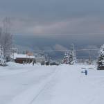 Frontage Road in Kenai is covered in compact snow.