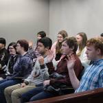 Nikiski Middle/High School seniors are sworn in as the jury during a mock trial at the Kenai Courthouse on Dec. 3, 2019. (Photo by Brian Mazurek/Peninsula Clarion)