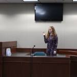 Nikiski Middle/High School senior Kaycee Bostic is sworn in to the witness stand during a mock trial at the Kenai Courthouse on Dec. 3, 2019. (Photo by Brian Mazurek/Peninsula Clarion)