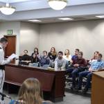 Nikiski Middle/High School senior Bryan McCollum, in his role as defense attorney, gives a closing statement to the jury during a mock trial at the Kenai Courthouse on Dec. 3, 2019. (Photo by Brian Mazurek/Peninsula Clarion)