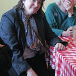 Alyse Galvin, who is running for the Alaska seat in the U.S. House of Representatives, listens to a community member speak during a meet and greet Sunday. Dec. 1, 2019 at K-Bay Caffee in Homer, Alaska. Galvin first ran to unseat Rep. Don Young in 2018. (Photo by Megan Pacer/Homer News)