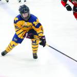 Homers Fiona Hatton reaches for the puck during a Friday, Dec. 6, 2019 hockey game against Juneau-Douglas High School at the Kevin Bell Arena in Homer, Alaska. (Photo by Megan Pacer/Homer News)