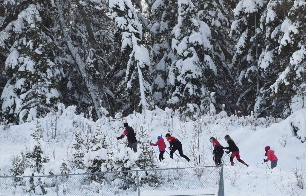 A group of skiers make their way along a trail behind Skyview High School, Saturday, Dec. 7, 2019, at the Black Stone Axe Ridge Warm Up Rally at the Tsalteshi Trails in Soldotna, Alaska. (Photo by Joey Klecka/Peninsula Clarion)