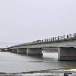 Cars drive through the rain on the Warren Ames Memorial Bridge on Bridge Access Road over the swift Kenai River on Monday, Dec. 9, 2019, in Kenai, Alaska. (Photo by Victoria Petersen/Peninsula Clarion)