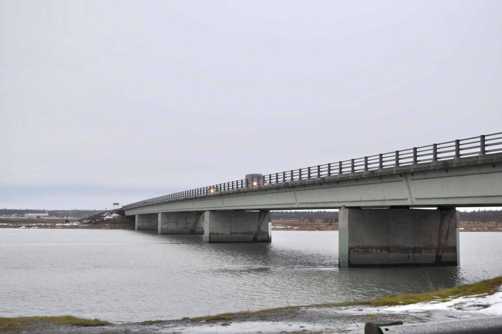 Cars drive through the rain on the Warren Ames Memorial Bridge on Bridge Access Road over the swift Kenai River on Monday, Dec. 9, 2019, in Kenai, Alaska. (Photo by Victoria Petersen/Peninsula Clarion)