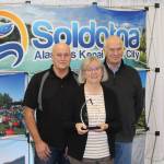 Dan Gensel, Kathy Gensel and Chamber President Jim Stogsdill smile for the camera at the Soldotna Chamber of Commerce Awards Luncheon at the Soldotna Regional Sports Complex on Dec. 11, 2019. (Photo by Brian Mazurek/Peninsula Clarion)