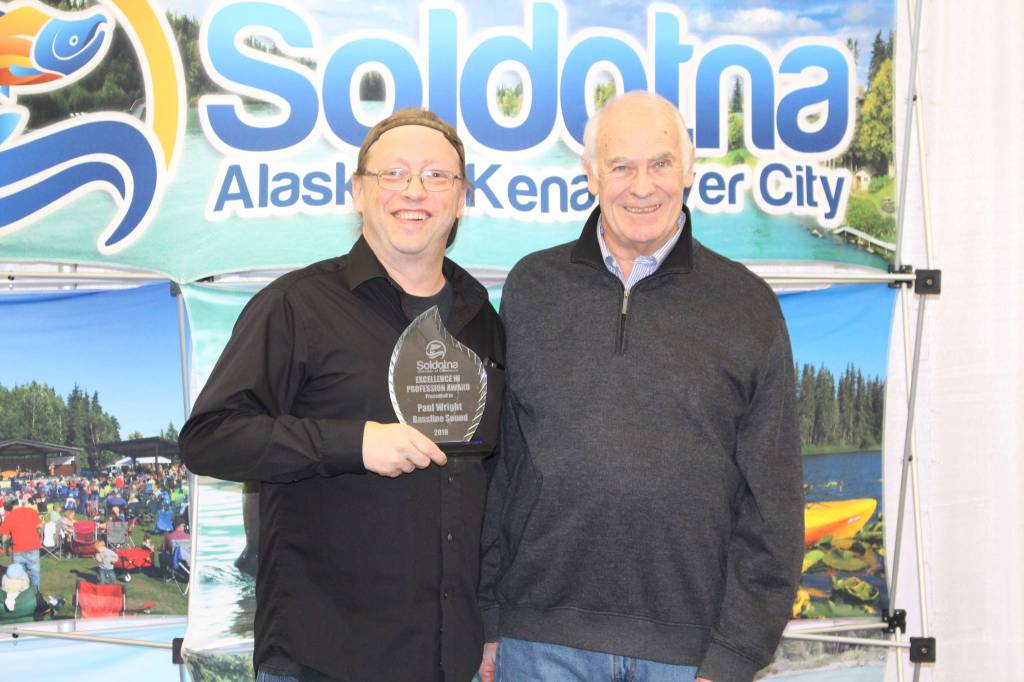 Paul Wright and Chamber President Jim Stogsdill smile for the camera at the Soldotna Chamber of Commerce Awards Luncheon at the Soldotna Regional Sports Complex on Dec. 11, 2019. (Photo by Brian Mazurek/Peninsula Clarion)