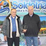 Pioneer Award winner Kearlee Wright and Chamber President Jim Stogsdill smile for the camera at the Soldotna Chamber of Commerce Awards Luncheon at the Soldotna Regional Sports Complex on Dec. 11, 2019. (Photo by Brian Mazurek/Peninsula Clarion)