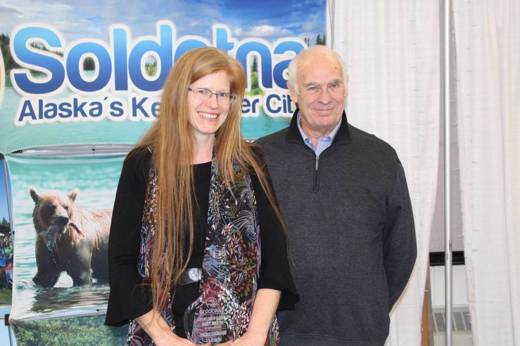Annette Villa and Chamber President Jim Stogsdill smile for the camera at the Soldotna Chamber of Commerce Awards Luncheon at the Soldotna Regional Sports Complex on Dec. 11, 2019. (Photo by Brian Mazurek/Peninsula Clarion)