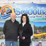 Chamber President Jim Stogsdill and Person of the Year Brenda Ahlberg smile for the camera at the Soldotna Chamber of Commerce Awards Luncheon at the Soldotna Regional Sports Complex on Dec. 11, 2019. (Photo by Brian Mazurek/Peninsula Clarion)