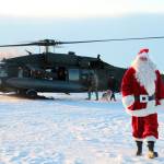 This Dec. 3, 2019 photo shows Santa Claus arriving in Napakiak, Alaska, on an Alaska National Guard UH-60 Black Hawk helicopter. The Guard brought its Operation Santa Claus to the western Alaska community, which is being severely eroded by the nearby Kuskokwim River. (AP Photo/Mark Thiessen)