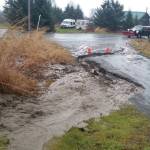 A partially washed out road can be seen on Newman Court in Diamond Ridge. (Photo courtesy of Kenai Peninsula Borough Office of Emergency Management)