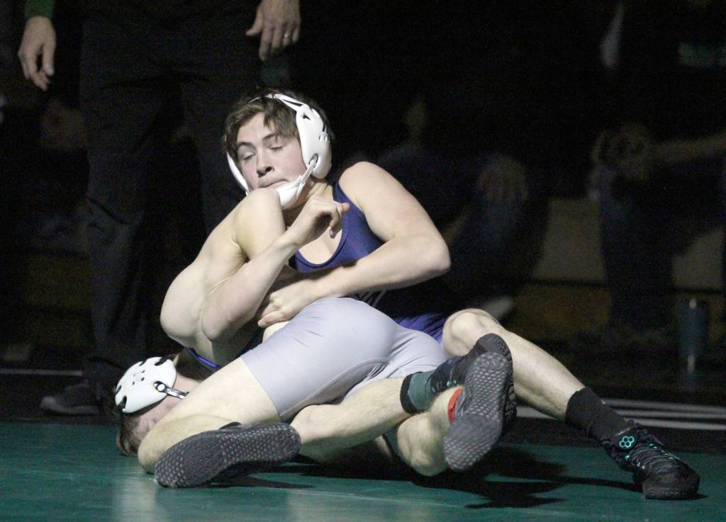 Soldotnas Scott Michael locks the arm of Palmers Aiden Corbridge during the 125-pound final of the Northern Lights Conference Championships Saturday, Dec. 14, 2019, at Colony High School. (Photo by Jeremiah Bartz/Frontiersman)
