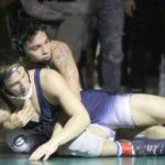 Soldotnas Dennis Taylor tries to escape the grasp of Colonys Vincent Cramer during the 152-pound final of the Northern Lights Conference Championships Saturday, Dec. 14, 2019, at Colony High School. (Photo by Jeremiah Bartz/Frontiersman)