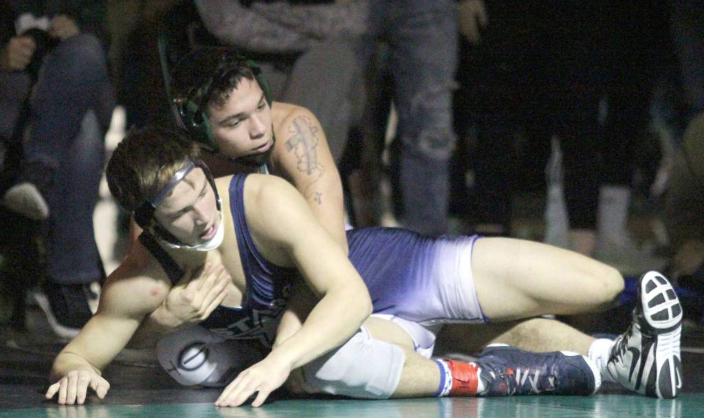 Soldotnas Dennis Taylor tries to escape the grasp of Colonys Vincent Cramer during the 152-pound final of the Northern Lights Conference Championships Saturday, Dec. 14, 2019, at Colony High School. (Photo by Jeremiah Bartz/Frontiersman)