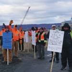 Longshore workers picket on the Homer Spit by Freight Dock Road on Tuesday, Dec. 17, 2019, in Homer, Alaska. They were part of a group of about 20 Alaska International Longshore and Warehouse Union members or supporters holding an area standards picket in response to Chumleys Inc. use of workers to load a sulfur hauler ship the ILWU alleges are paid substandard wages. (Photo by Michael Armstrong/Homer News)