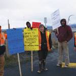 Homer longshore workers picket on the Homer Spit by Freight Dock Road on Tuesday, Dec. 17, 2019, in Homer, Alaska. They were part of a group of about 20 Alaska International Longshore and Warehouse Union members or supporters hold an area standards picket in response to Chumleys Inc. use of workers to load a sulfur hauler ship the ILWU alleges are paid substandard wages. From left to right, are Grant Lane, Paul Gregoire, Carley Conemac, Jeff Allmendinger and Brian Dingman. (Photo by Michael Armstrong/Homer News)