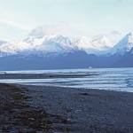 Sun reflects off snow covering the mountains across Resurrection Bay from the Tonsina Point area on Sunday, Dec. 8, 2019 near Lowell Point, Alaska. (Photo by Megan Pacer/Homer News)