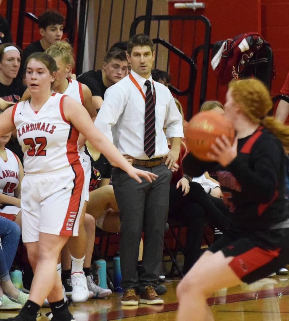 Kenai Central girls basketball head coach Jeff Swick surveys the action Thursday, Dec. 19, 2019, at the Craig Jung Kenai River Challenge tournament at Kenai Central High School. Swick was making his first start as varsity head coach of the team. (Photo by Joey Klecka/Peninsula Clarion)