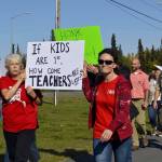 Educators rally in front of Kenai Central High School ahead of a strike slated to begin Tuesday, on Monday, Sept. 16, 2019, in Kenai, Alaska. (Photo by Victoria Petersen/Peninsula Clarion)
