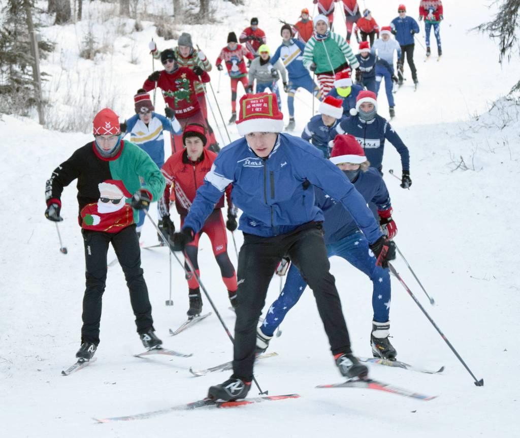 Soldotnas Jack Harris leads racers up the first hill in the Candy Cane Scramble on Friday, Dec. 20, 2019, at Tsalteshi Trails near Soldotna, Alaska. (Photo by Jeff Helminiak/Peninsula Clarion)