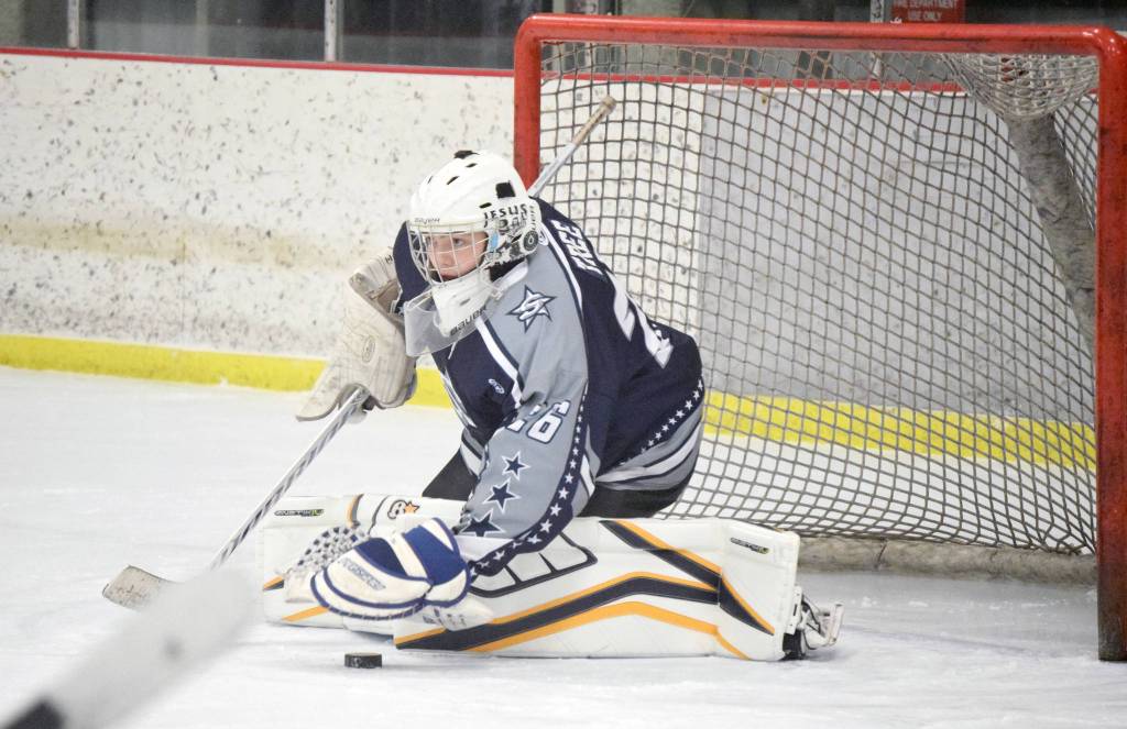 Soldotna goaltender Josh Tree makes a save against Kenai Central on Friday, Dec. 20, 2019, at the Kenai Multi-Purpose Facility in Kenai, Alaska. (Photo by Jeff Helminiak/Peninsula Clarion)