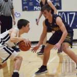 Homers Clayton Beachy (right) keeps close watch on Soldotnas Jersey Truesdell, Friday, Dec. 20, 2019, at the Powerade/Al Howard Tip-Off tournament at Soldotna High School. (Photo by Joey Klecka/Peninsula Clarion)