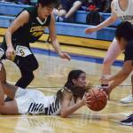 Soldotnas Drysta Crosby-Schneider retains possesson of the ball after falling Friday, Dec. 20, 2019, against Service at the Powerade/Al Howard Tip-Off tournament at Soldotna High School. (Photo by Joey Klecka/Peninsula Clarion)