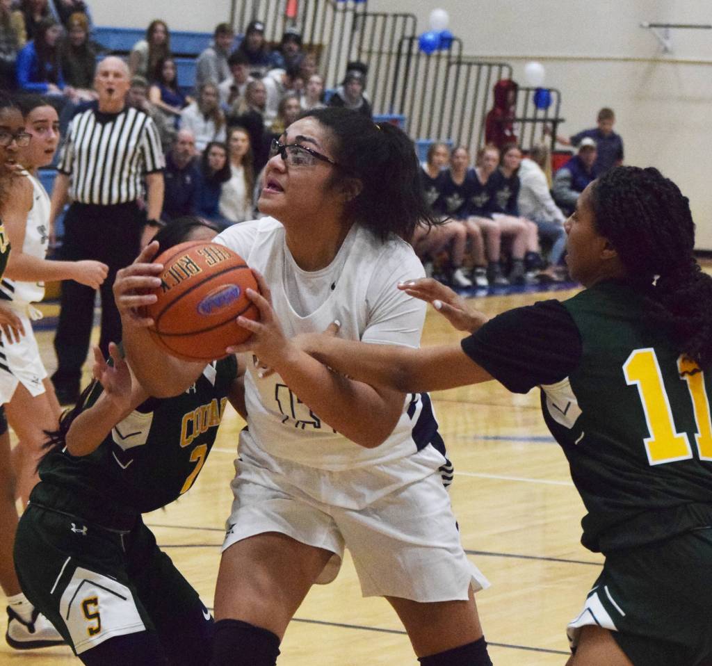 Soldotnas Ituau Tuisaula powers through the Service defense for a layup Friday, Dec. 20, 2019, at the Powerade/Al Howard Tip-Off tournament at Soldotna High School. (Photo by Joey Klecka/Peninsula Clarion)