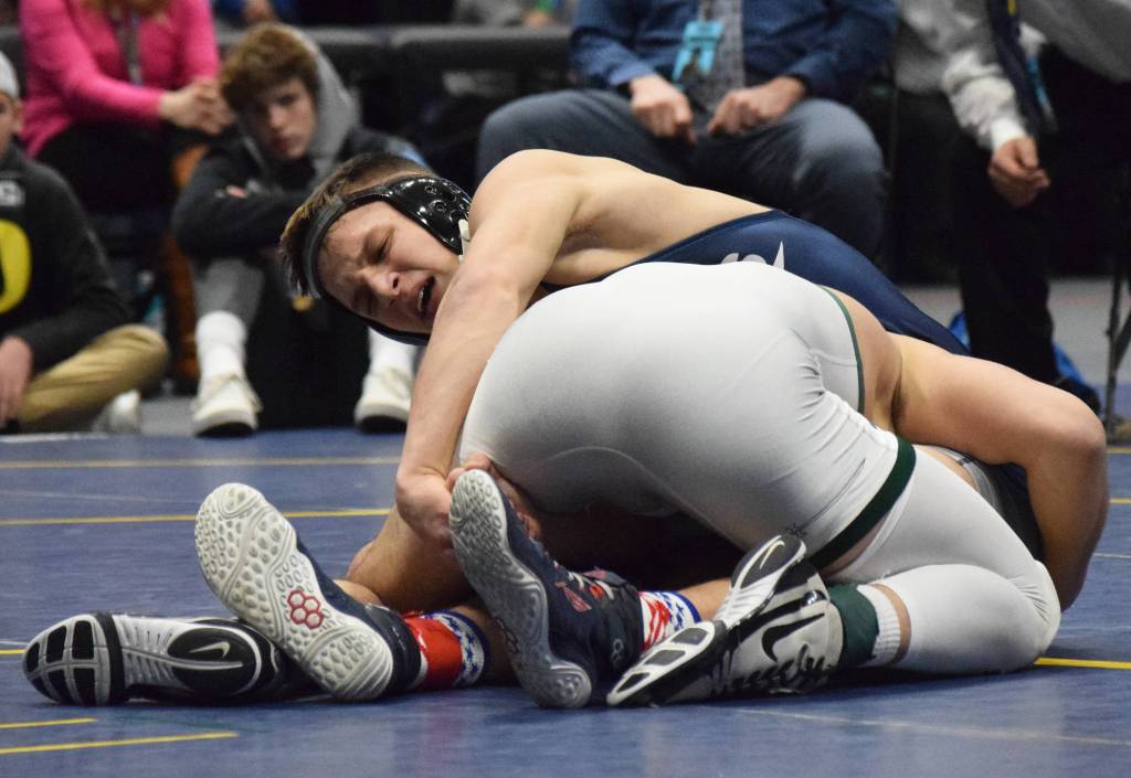 Soldotnas Dennis Taylor battles Colonys Vincent Cramer in the Division I boys 152-pound final Saturday, Dec. 21, 2019, at the ASAA State Wrestling Championships at the Alaska Airlines Center in Anchorage, Alaska. (Photo by Joey Klecka/Peninsula Clarion)